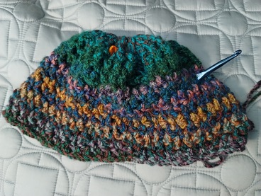 Hat started in two different colorways of Premier Puzzle
